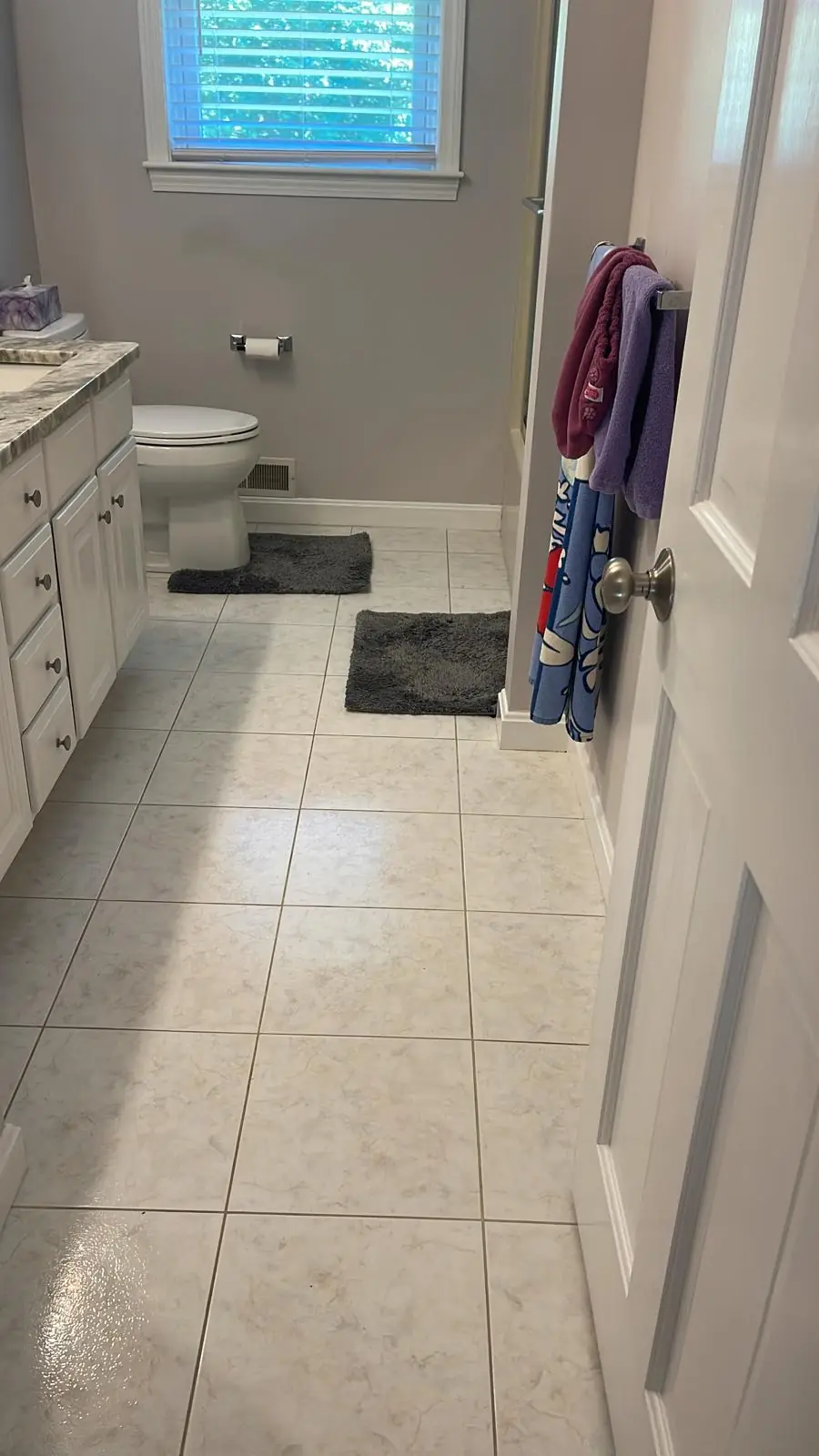 Clean bathroom tile floor after a residential cleaning in Clinton, MA
