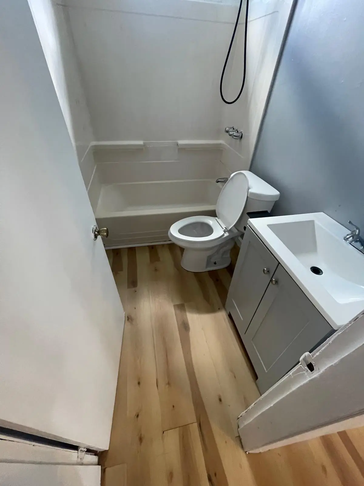 Clean bathroom with shower and tub combo after a deep cleaning in Clinton, MA