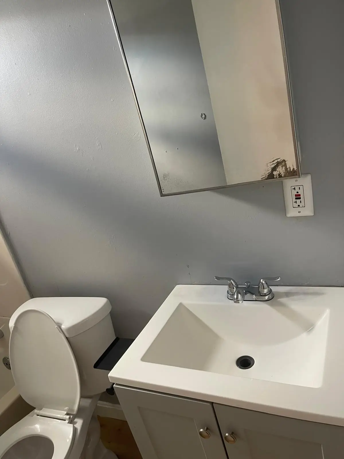 Clean bathroom sink and toilet after a deep cleaning in Clinton, MA