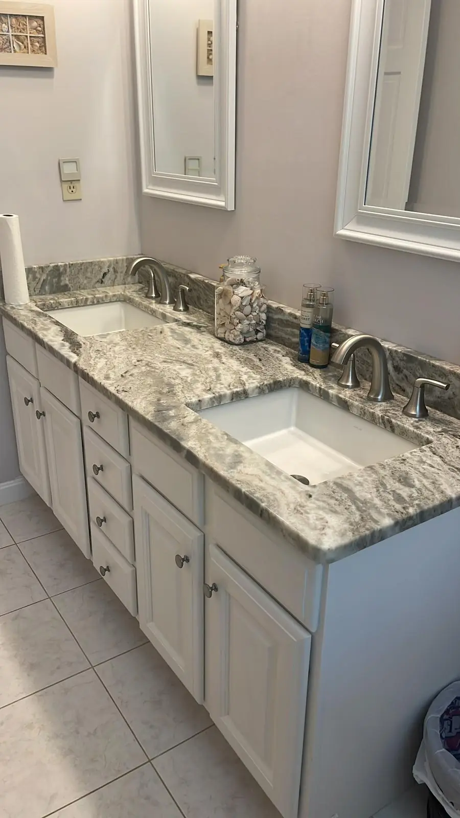 Clean granite double-sink bathroom vanity after a Magic Cleaning visit in Clinton, MA