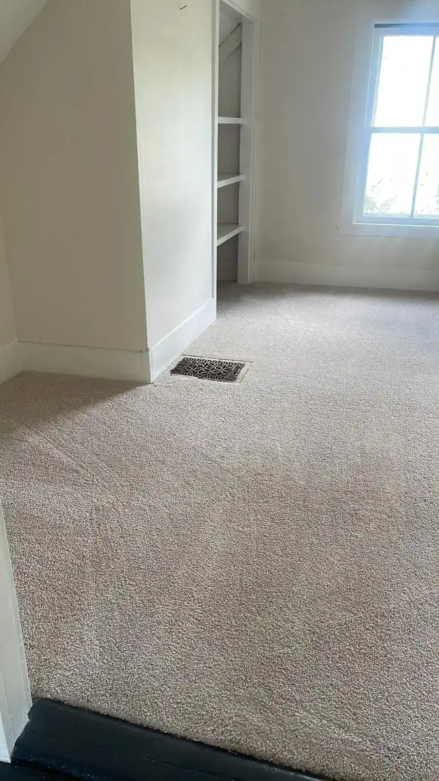 Freshly cleaned carpet by a closet after a move-out cleaning in Clinton, MA