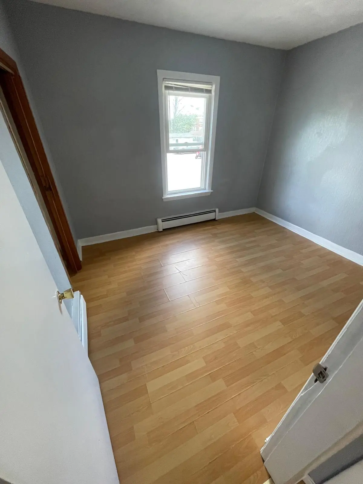 Empty bedroom with clean hardwood floor, ready for move-in, Clinton, MA