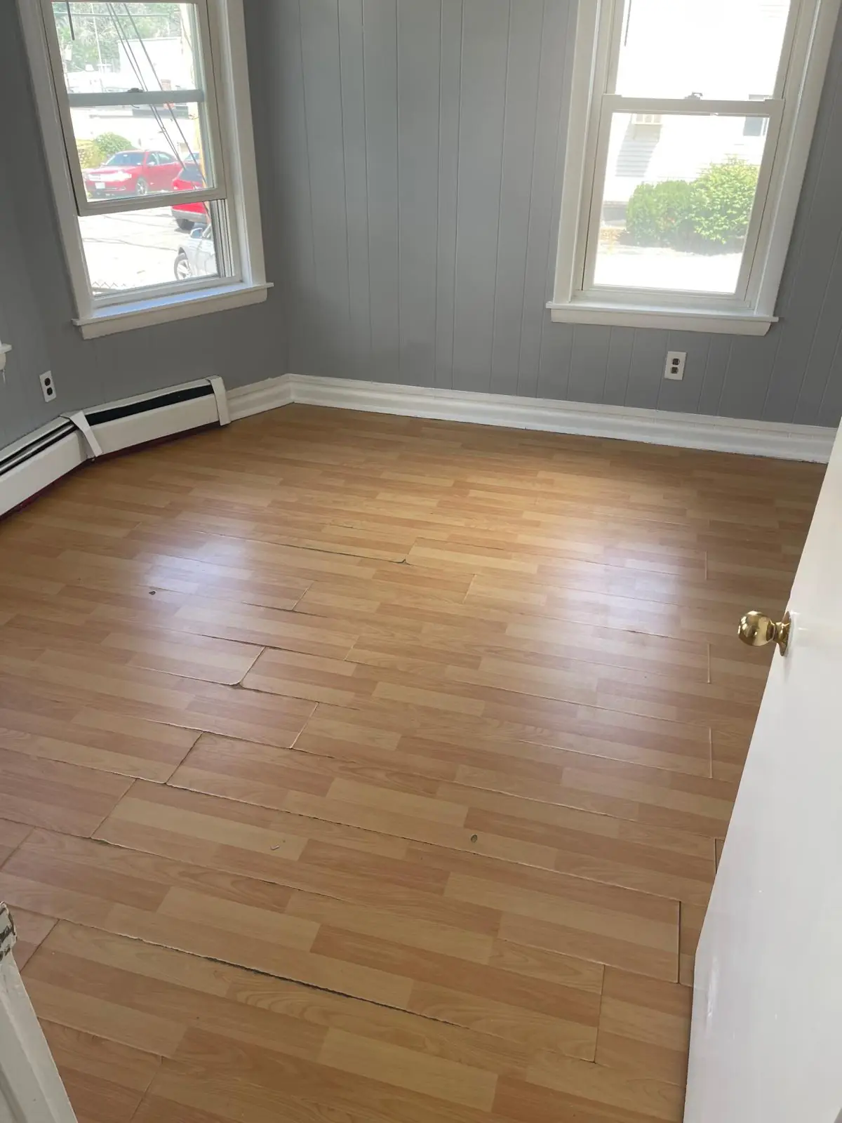 Clean hardwood floor in a bay window room after a house cleaning in Clinton, MA