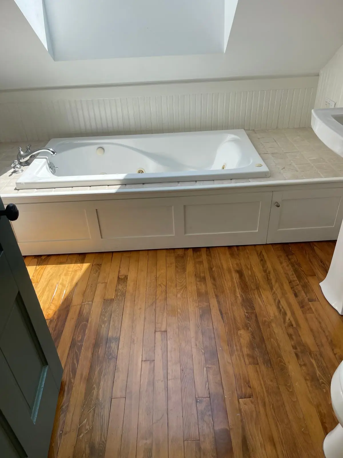 Clean jacuzzi soaking tub under a skylight after a deep cleaning in Clinton, MA