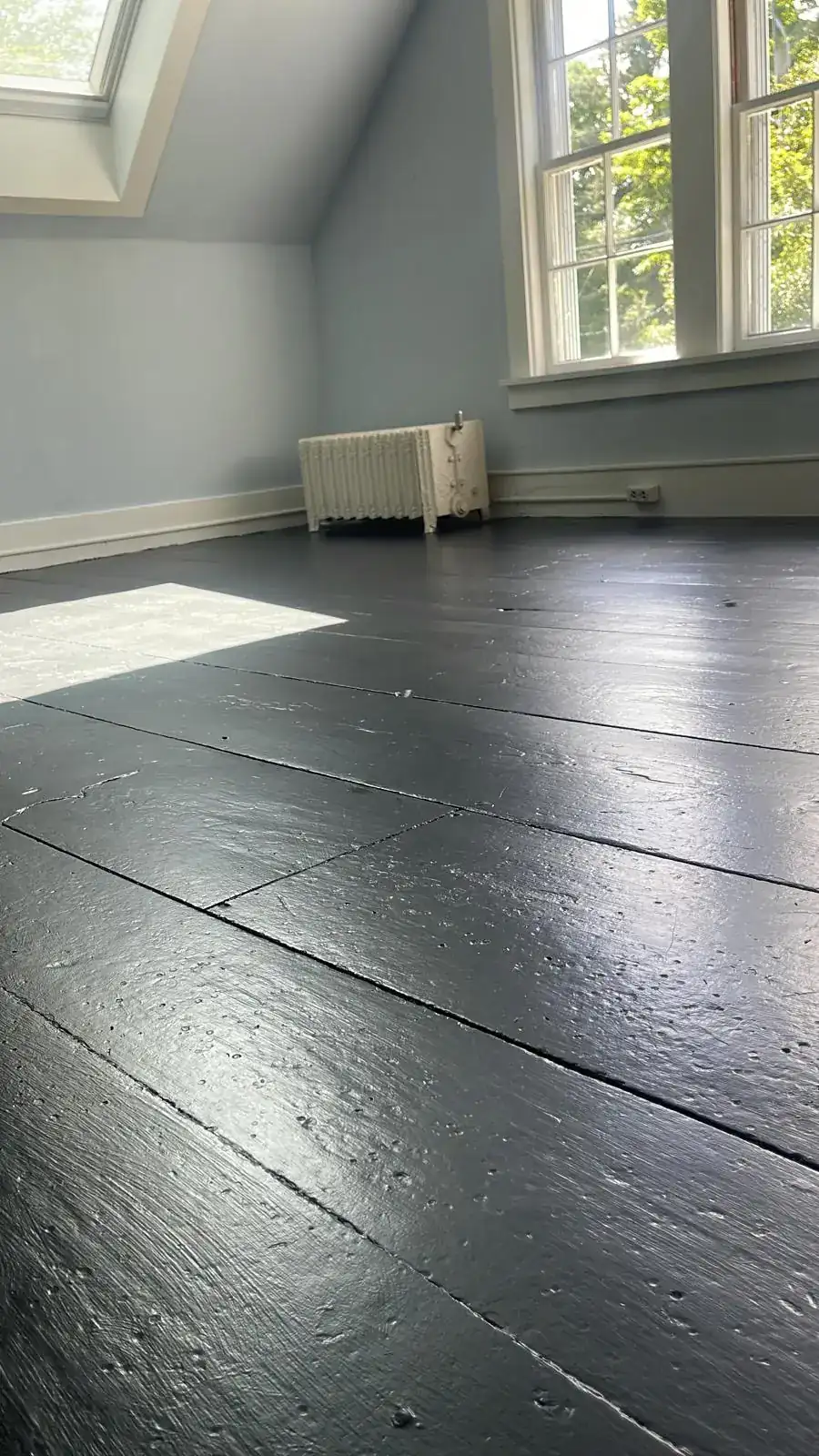 Clean painted wood floor in an empty room after a move-out cleaning in Clinton, MA